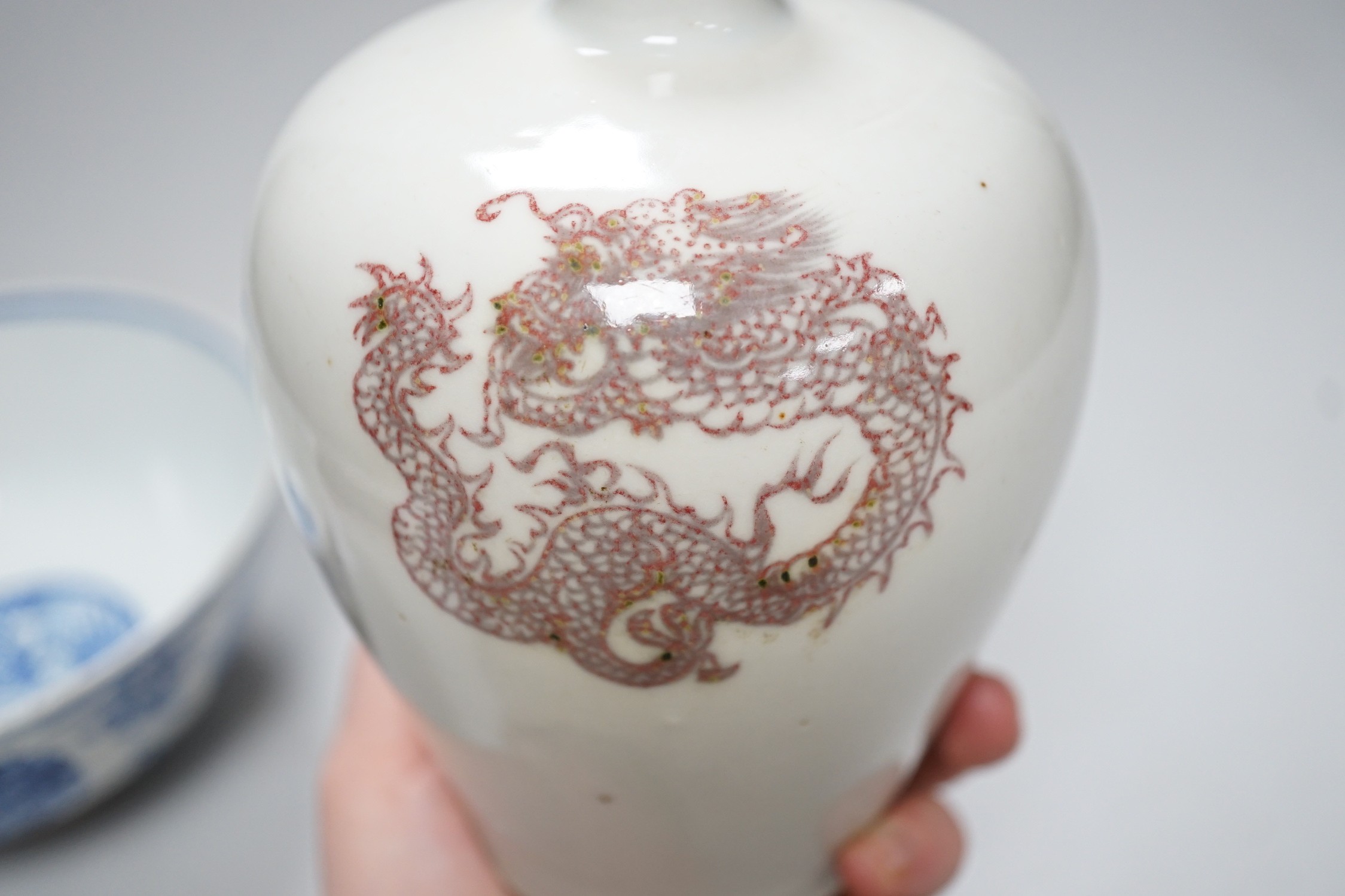A Chinese underglaze copper red meiping a.f. and a Chinese blue and white bowl. Tallest 15cm